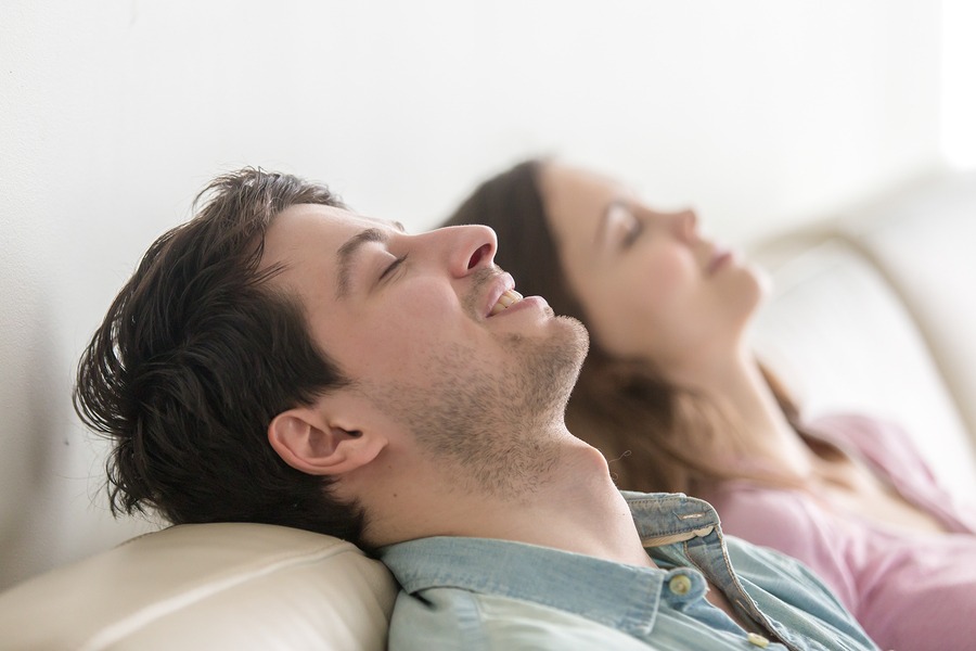 Couple showing how to eliminate stress with relaxation